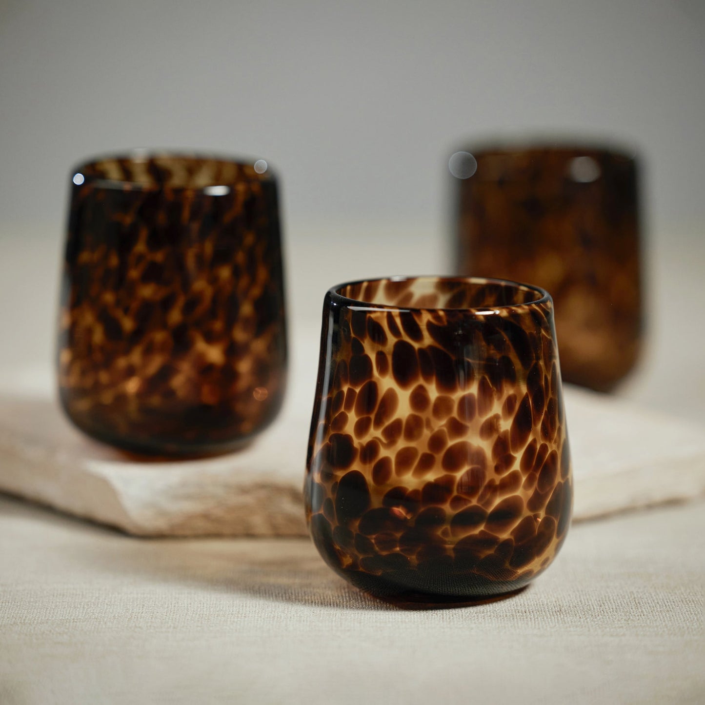 Stemless Tortoise All Purpose Glass - Amber & Black/Amber & Black Spiral sold in Sets of 6